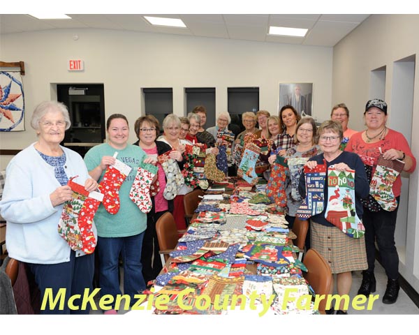 Local quilters make hundreds of stockings for kids in need